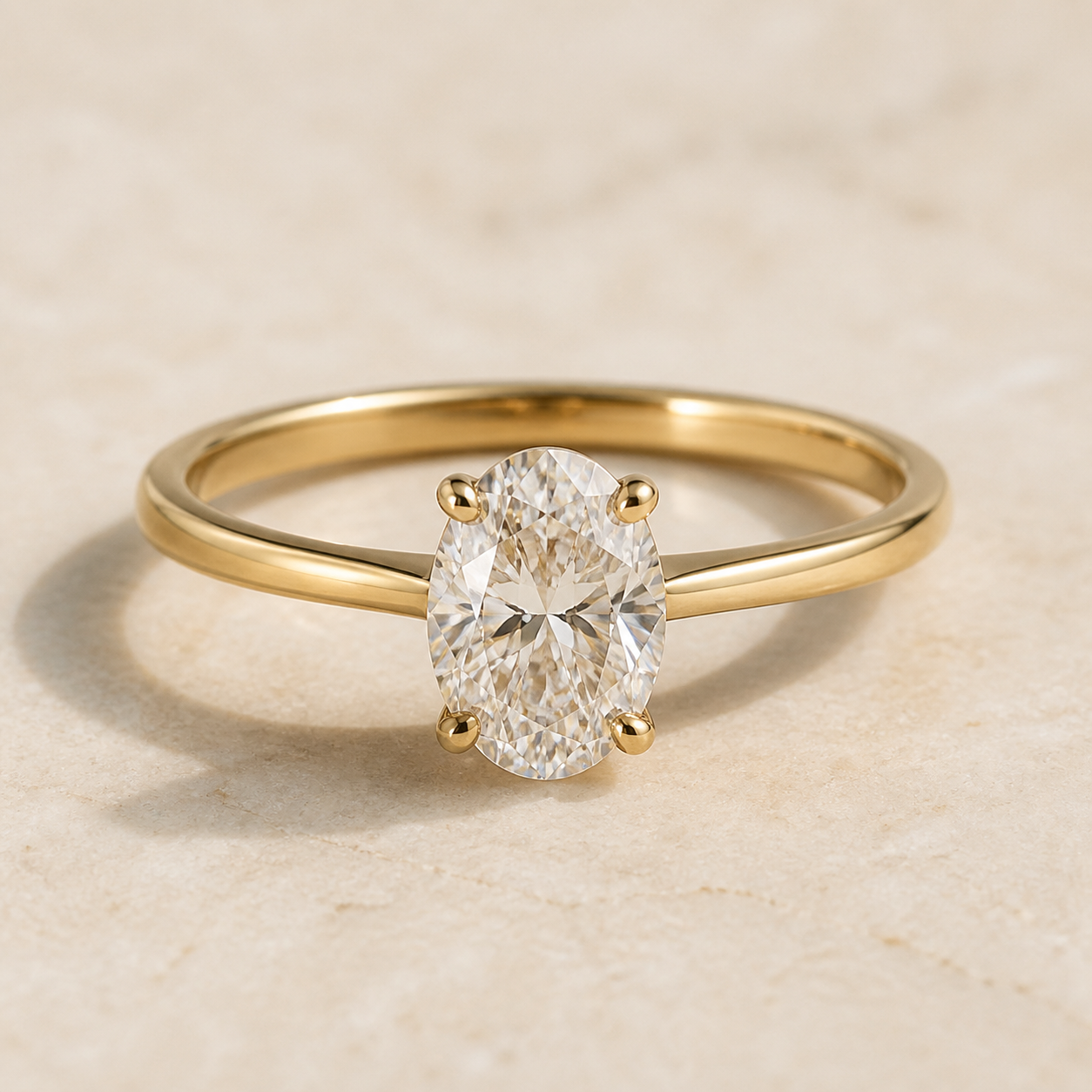 Aurelia gold solitaire ring with an oval diamond
